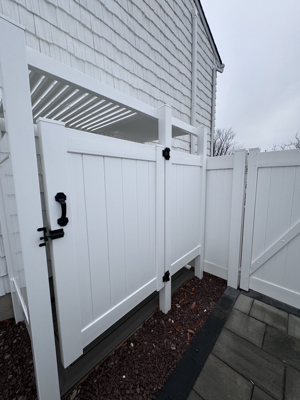 Stone Harbor NJ outdoor shower louvered roof black hardware