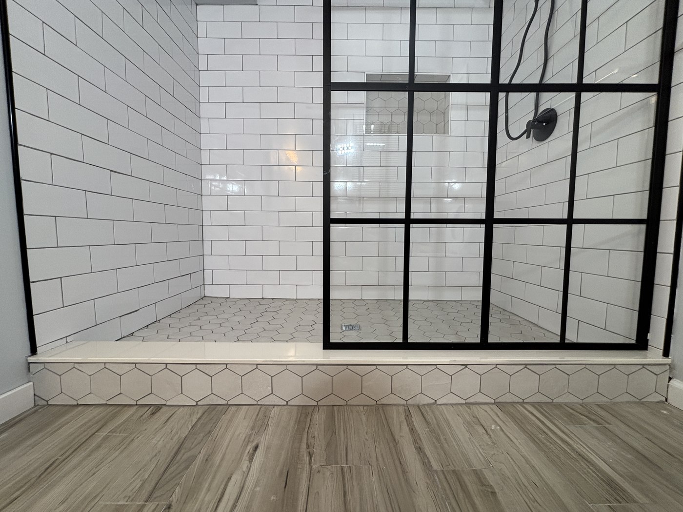 Wildwood NJ bathroom shower hexagon floor black grid glass detail