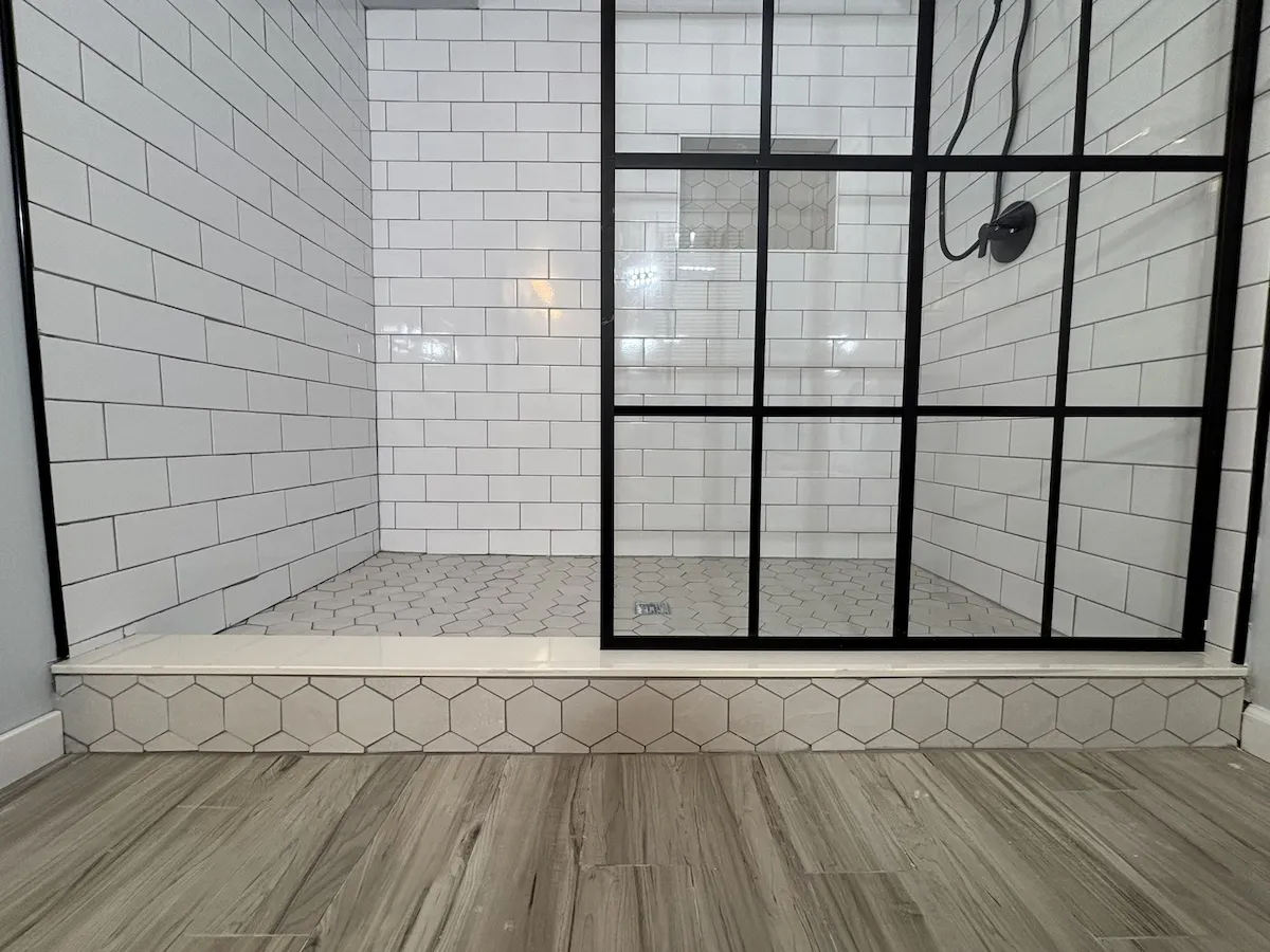 Wildwood NJ bathroom hexagon floor and black grid glass door detail