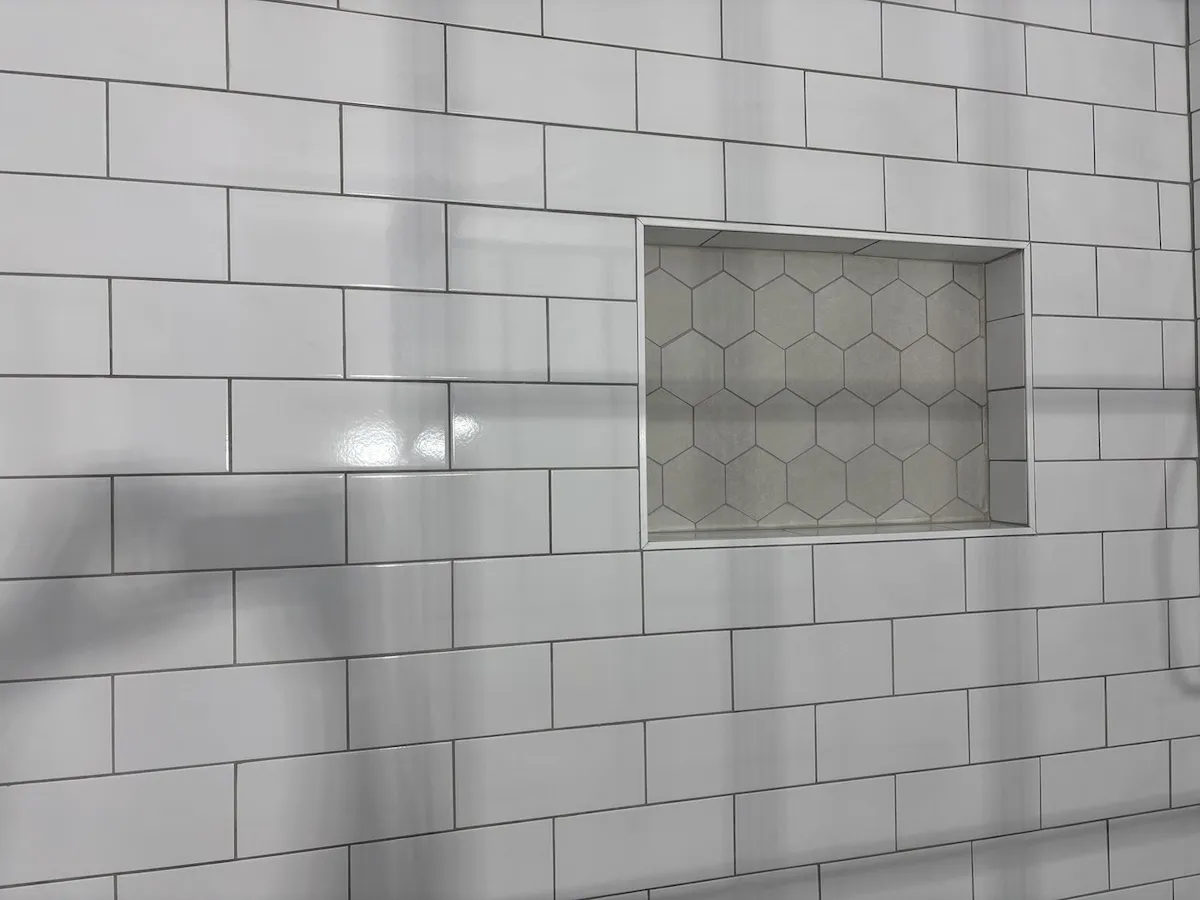 Wildwood NJ bathroom shower niche with hexagon tile detail and subway wall