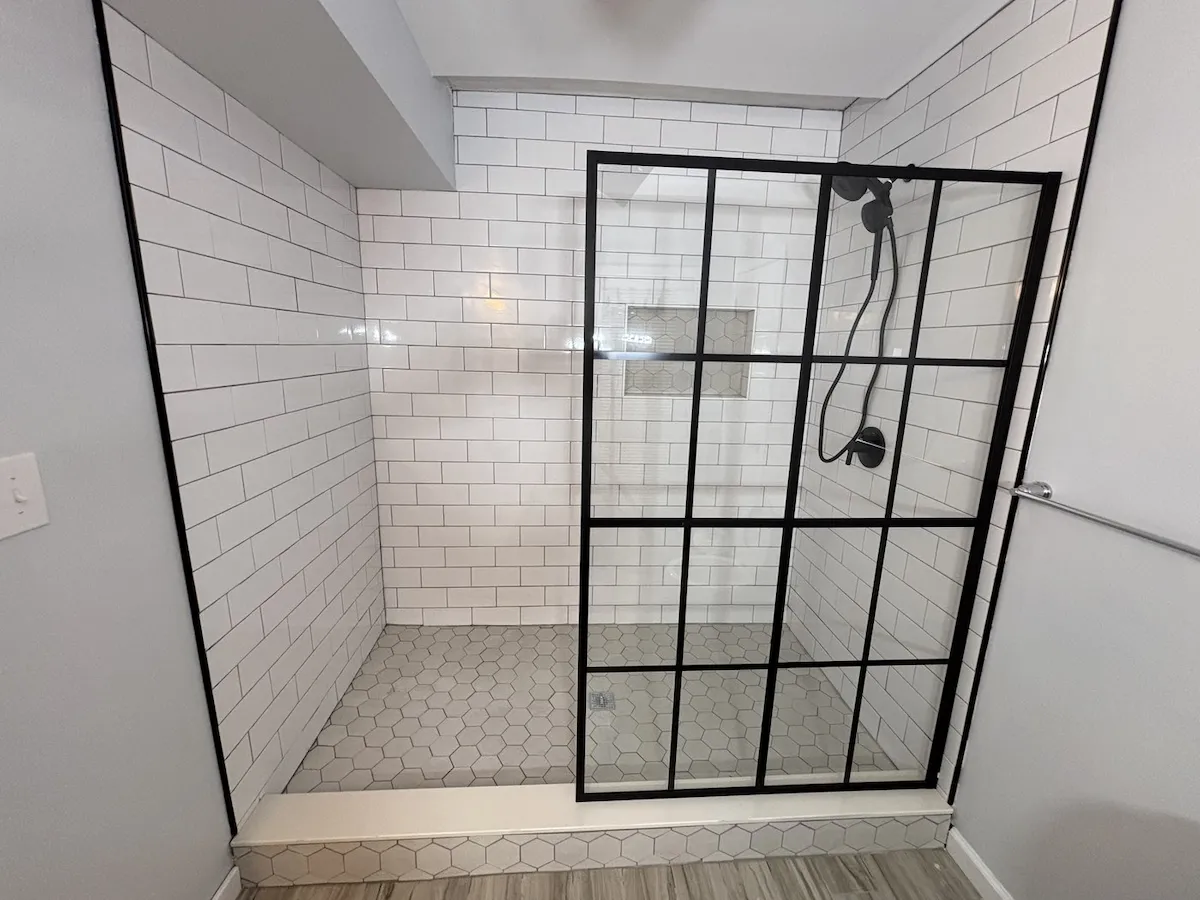 Wildwood NJ bathroom after renovation — subway tile walk-in shower with hexagon floor