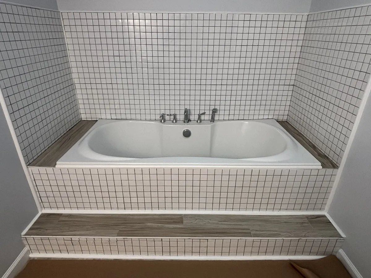 Wildwood NJ bathroom before renovation — old soaking tub with square tile